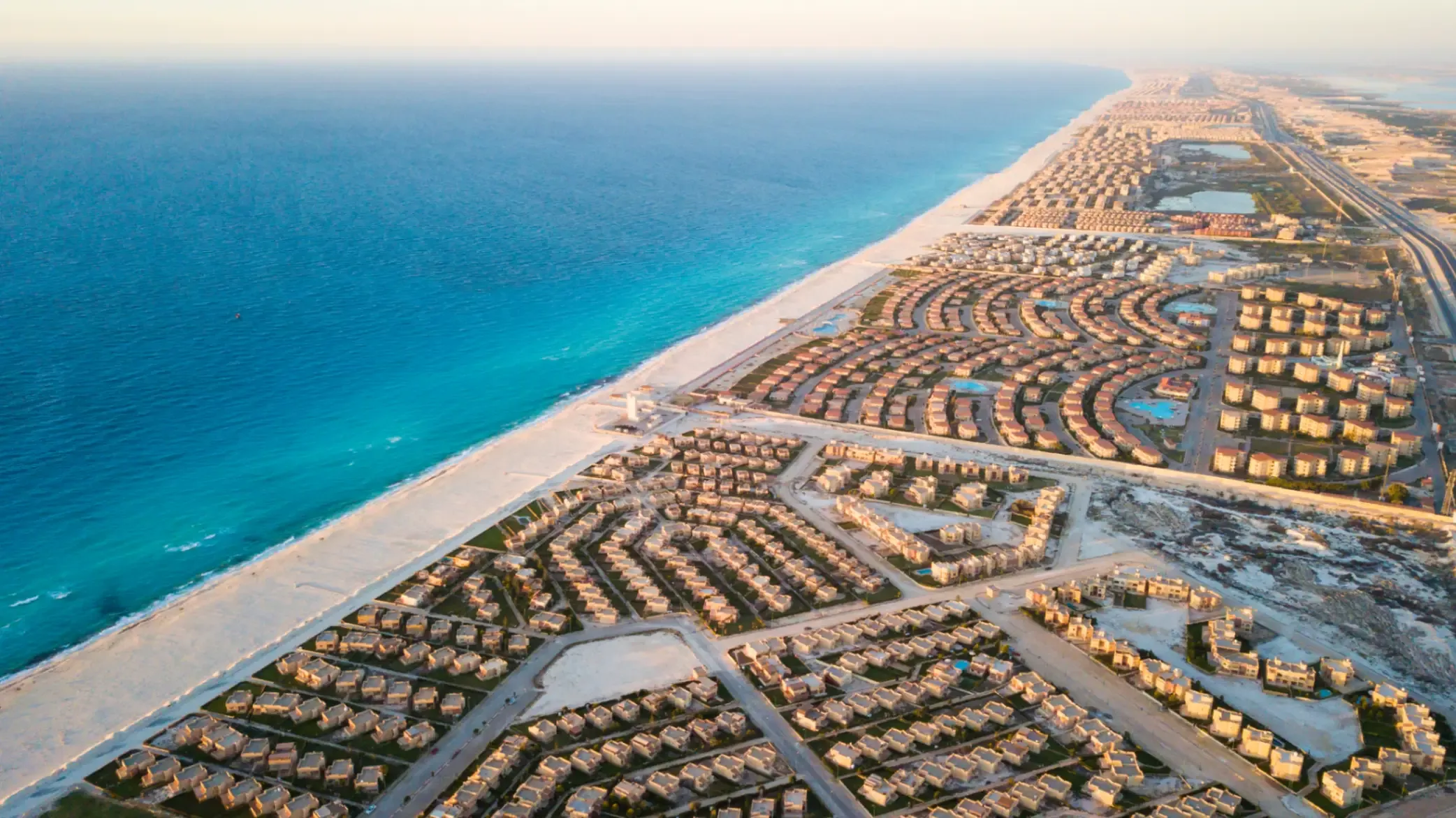 Aerial photograph of a coastal real estate development located on the North Coast of Egypt. 