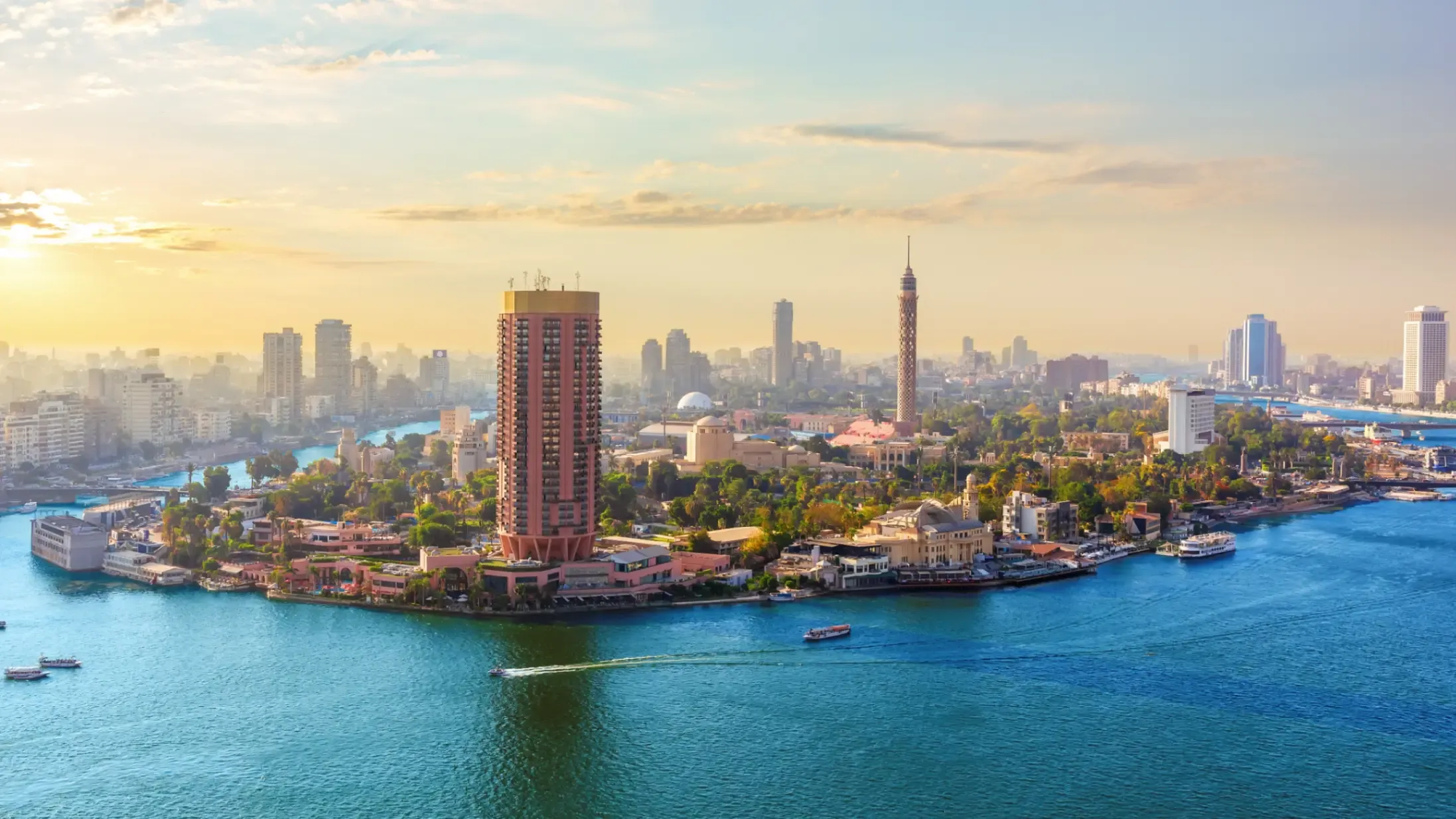 Cairo skyline and the Nile river at sunset. 