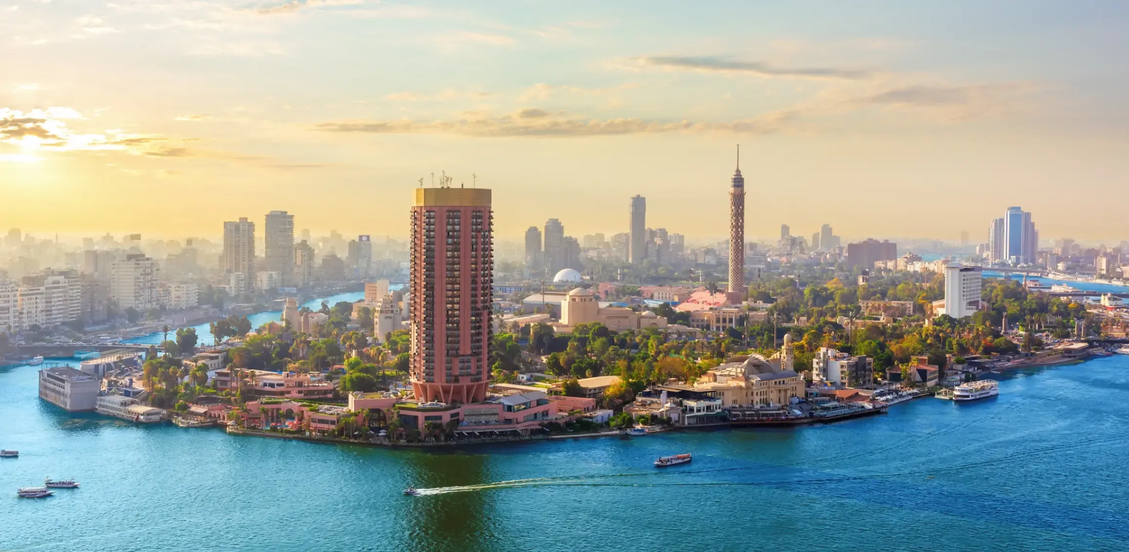 Cairo skyline and the Nile river at sunset. 