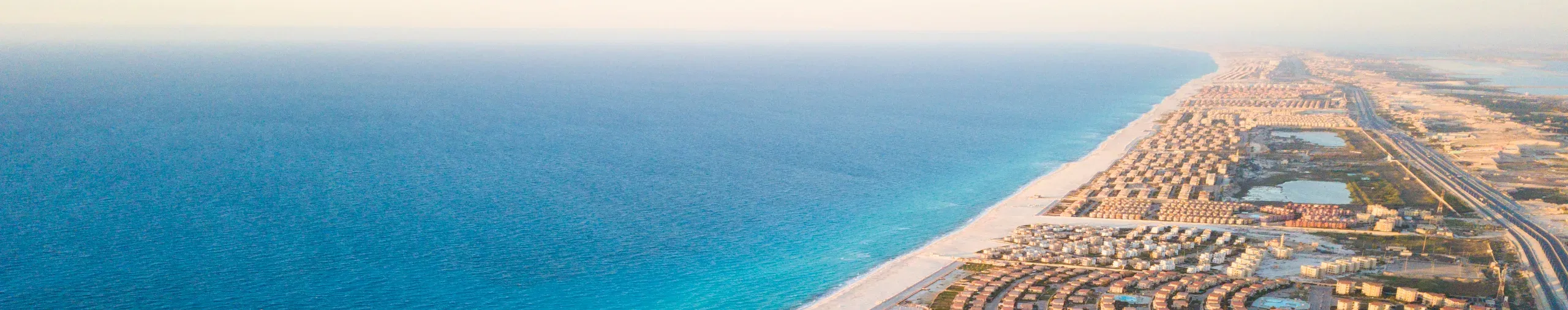 Aerial photograph of a coastal real estate development located on the North Coast of Egypt. 